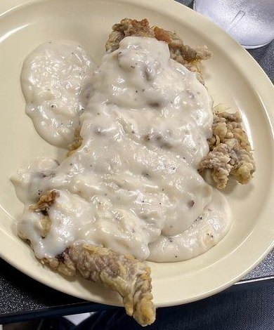 Country fried steak smothered in sausage gravy