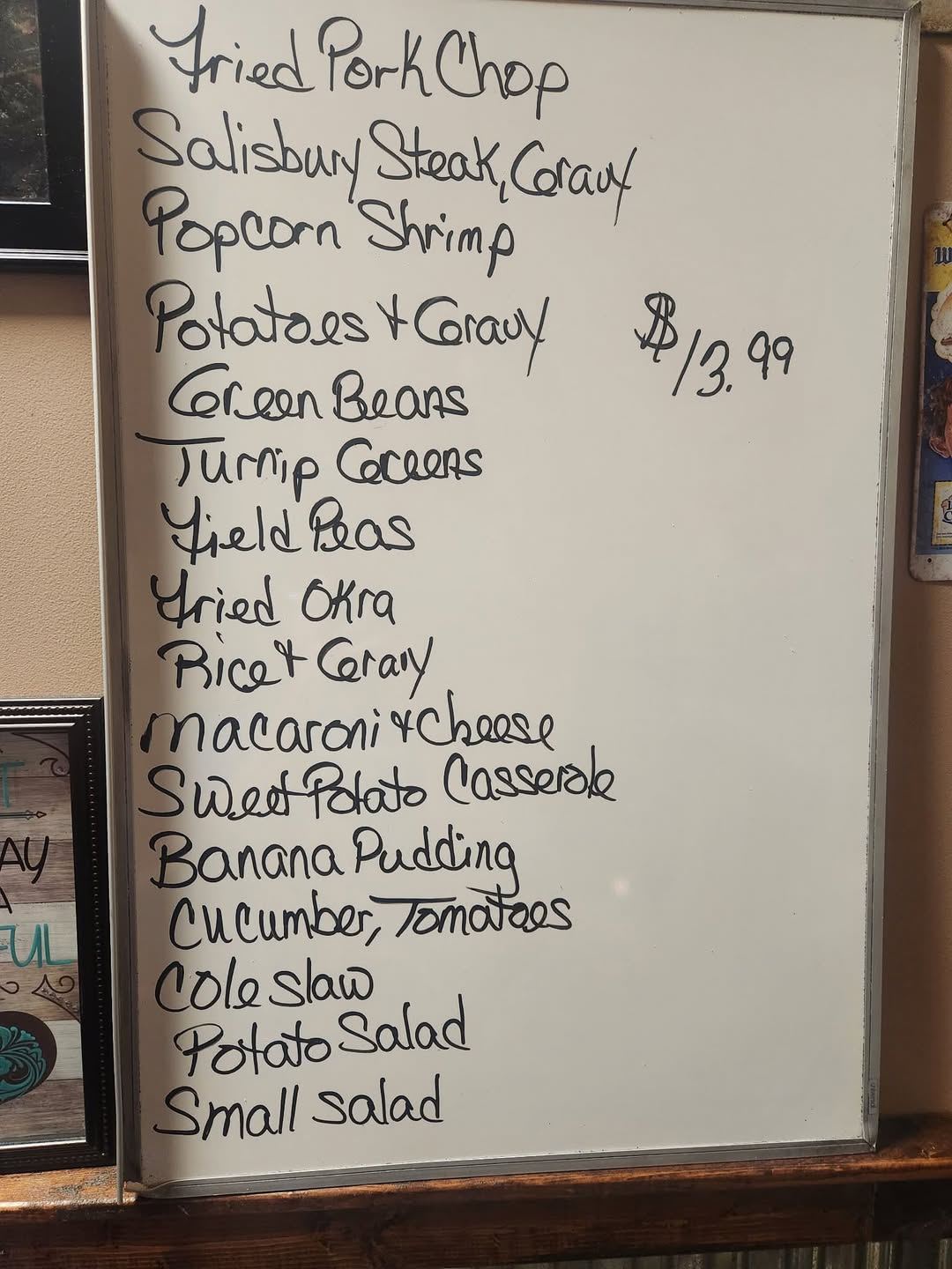 The daily specials whiteboard: fried pork chop, Salisbury steak, popcorn shrimp and a long list of sides